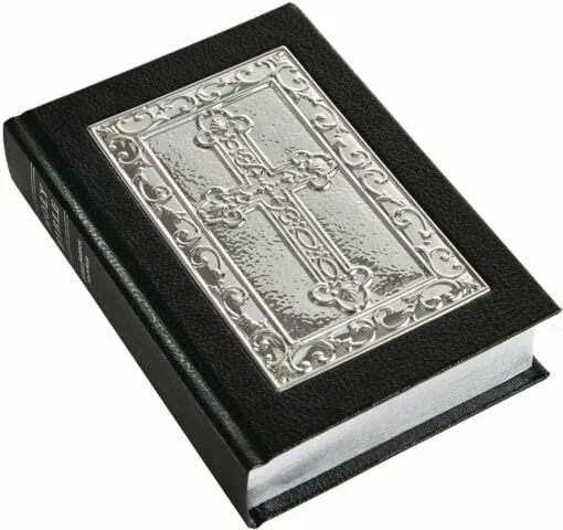 sterling silver bible with ornate detail and black cover