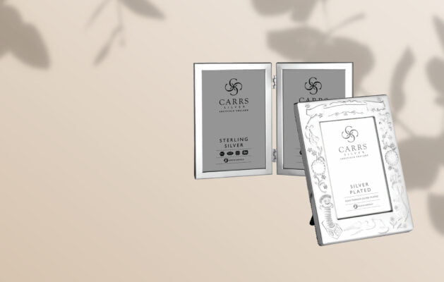 a selection of silver photo frames on a neutral background
