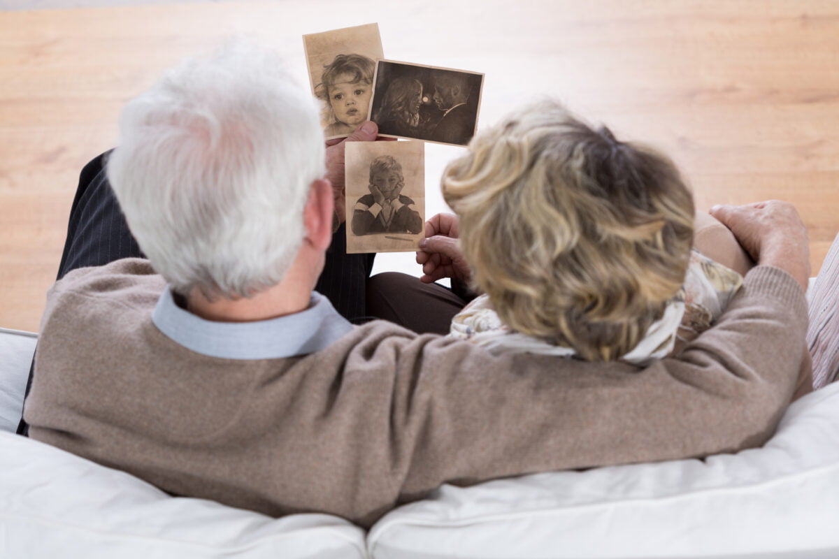 couple looking at old photographs