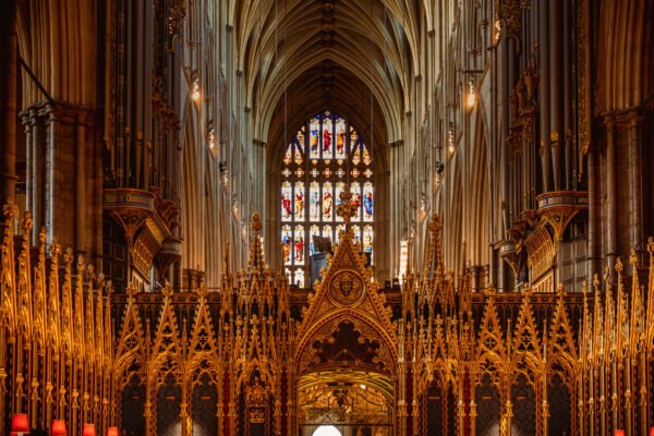 Inside view of Westminster Abbey with an arched roof and altar