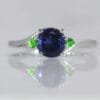 white gold cross over ring with Iolite and Tsavorite