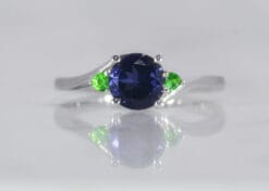 white gold cross over ring with Iolite and Tsavorite