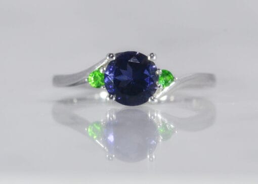 white gold cross over ring with Iolite and Tsavorite