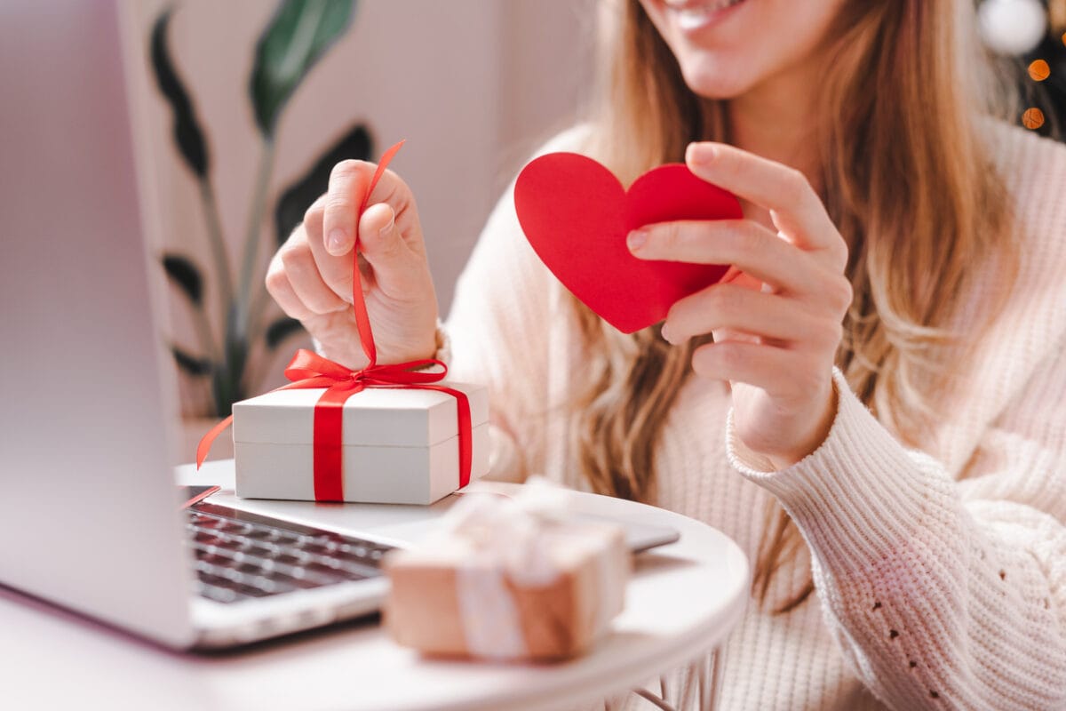 woman holding valentines day gift in gift box