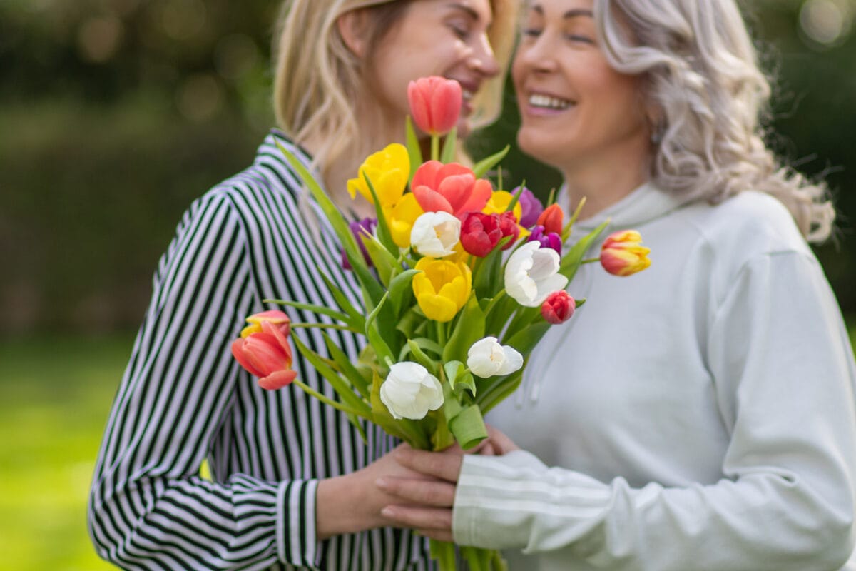 Daughter hugs mother
