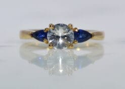 three stone yellow gold sapphire ring