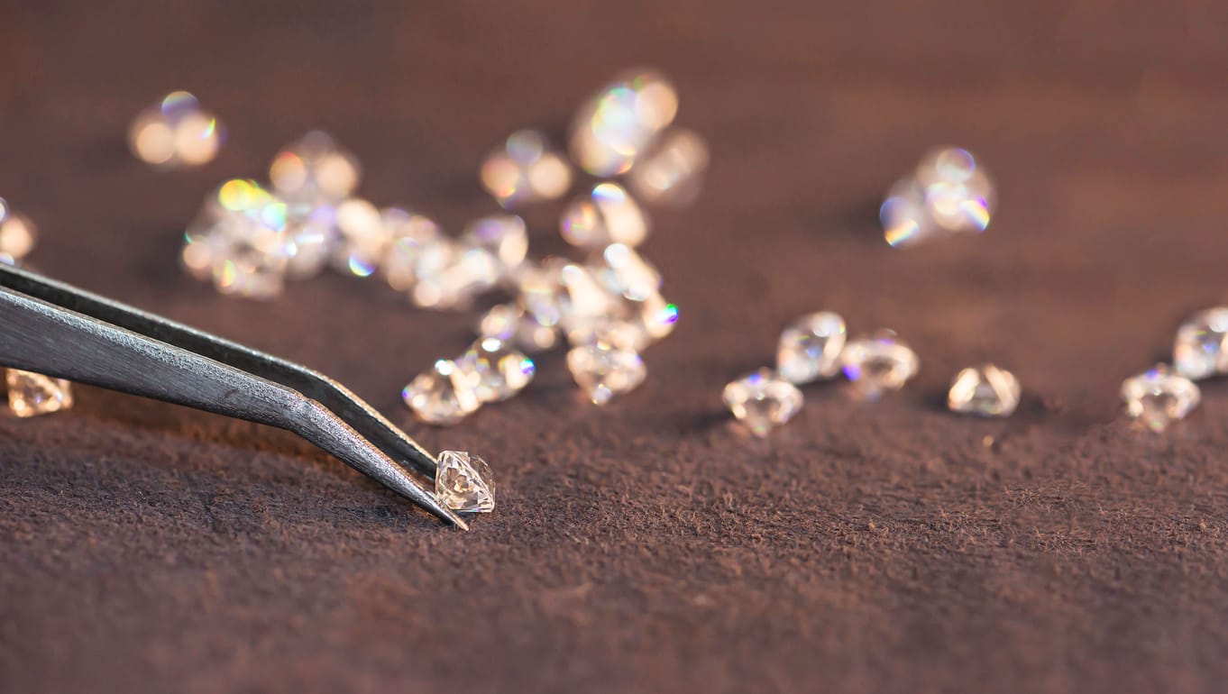 diamonds being held by tweezers