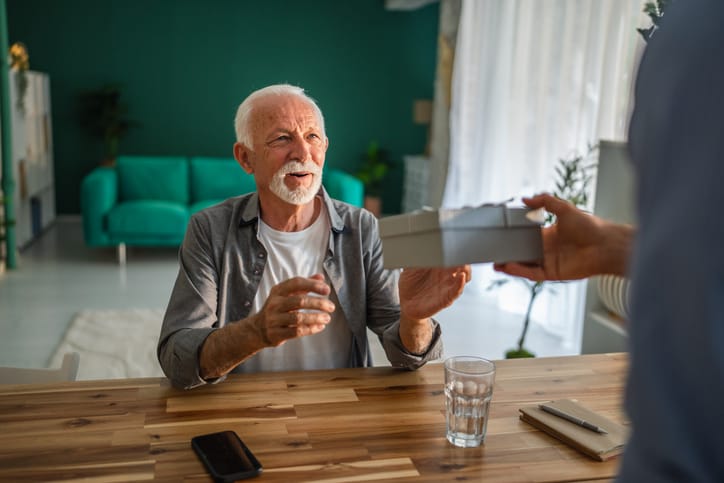 Senior man receiving gift