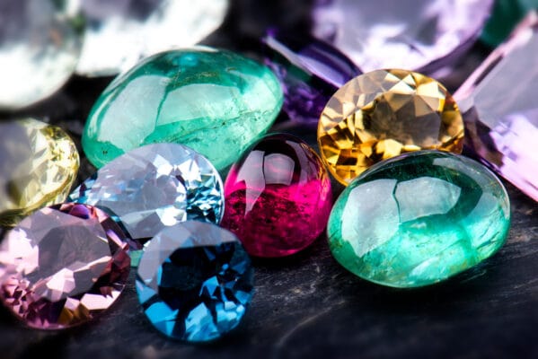 array of gemstones on a black surface