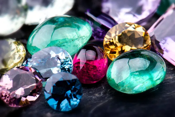 array of gemstones on a black surface